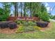 Brick sign at the entrance of Brook Forest, surrounded by landscaped bushes and greenery at 2739 Springfount Trl, Lawrenceville, GA 30043