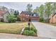 Charming brick home with a well-manicured lawn, a two-car garage, and a welcoming red front door at 2739 Springfount Trl, Lawrenceville, GA 30043
