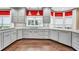 Modern kitchen with gray cabinetry, granite countertops, stainless steel appliances, and hardwood flooring at 2739 Springfount Trl, Lawrenceville, GA 30043
