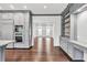 Modern kitchen with gray cabinets, stainless steel appliances, built-in shelving, and hardwood flooring at 2739 Springfount Trl, Lawrenceville, GA 30043