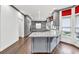 Stylish kitchen with gray cabinets, granite countertops, and a large center island at 2739 Springfount Trl, Lawrenceville, GA 30043