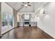Open living room featuring a fireplace, stylish lighting fixtures, and doors leading to a deck at 2739 Springfount Trl, Lawrenceville, GA 30043