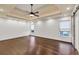 Spacious main bedroom with hardwood floors, tray ceiling, and recessed lighting at 2739 Springfount Trl, Lawrenceville, GA 30043