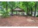 Community picnic area featuring a covered pavilion with picnic tables and seating, nestled among mature trees at 2739 Springfount Trl, Lawrenceville, GA 30043