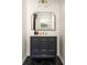 Modern bathroom with stylish black vanity and hexagon tiled floor at 3095 Meadow Lark Ln, Atlanta, GA 30344