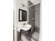 Modern bathroom with gray tiled shower and stylish vanity at 3095 Meadow Lark Ln, Atlanta, GA 30344