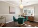 Stylish dining room featuring a modern chandelier and seating for four at 3095 Meadow Lark Ln, Atlanta, GA 30344