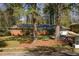 Beautiful brick house with a well-maintained lawn, driveway, and mature trees at 3095 Meadow Lark Ln, Atlanta, GA 30344
