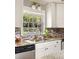 Bright kitchen view featuring a window over the sink and granite countertops with stainless steel appliances at 3095 Meadow Lark Ln, Atlanta, GA 30344