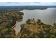 Aerial view of a peninsula on the lake surrounded by dense woods at 328 Allatoona Shores Dr, Canton, GA 30114