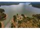 Picturesque aerial of a lake with a boat launch surrounded by trees at 328 Allatoona Shores Dr, Canton, GA 30114