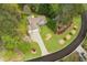 An aerial view highlighting the manicured lawn, roof and driveway of this attractive single-Gathering home at 328 Allatoona Shores Dr, Canton, GA 30114
