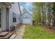 View of backyard with grassy area and trees beyond the property line at 328 Allatoona Shores Dr, Canton, GA 30114