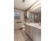 Bathroom featuring white vanity, floral wallpaper, and tiled floors at 328 Allatoona Shores Dr, Canton, GA 30114