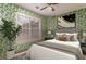 Bedroom with leaf wallpaper, ceiling fan, neutral bedding, and natural light at 328 Allatoona Shores Dr, Canton, GA 30114