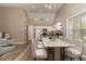 Open floor plan dining area with kitchen view featuring modern white chairs and marble table at 328 Allatoona Shores Dr, Canton, GA 30114