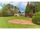 Well-maintained lawn, a house with light blue siding, and a beautiful flower bed adorn this home's exterior at 328 Allatoona Shores Dr, Canton, GA 30114
