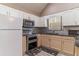 Bright kitchen with stainless steel appliances, granite countertops, and white cabinets at 328 Allatoona Shores Dr, Canton, GA 30114