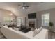 Bright living room features a fireplace, vaulted ceiling, and dining area at 328 Allatoona Shores Dr, Canton, GA 30114