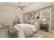 Main bedroom featuring stone accent wall, ceiling fan, and neutral decor at 328 Allatoona Shores Dr, Canton, GA 30114