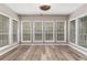 Bright sunroom with many windows and wood-look flooring, perfect for relaxation and enjoying natural light at 328 Allatoona Shores Dr, Canton, GA 30114