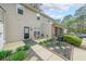 Backyard patio with black door, seating area, and greenery at 3729 Town Square Nw Cir # 6, Kennesaw, GA 30144