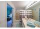 En Suite bathroom with double vanity, tiled floor, and bathtub/shower combination at 3729 Town Square Nw Cir # 6, Kennesaw, GA 30144