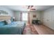 Comfortable bedroom with ceiling fan, accent rug, and natural light from the window at 3729 Town Square Nw Cir # 6, Kennesaw, GA 30144