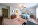 Bedroom boasts a ceiling fan, a walk-in closet, and natural light at 3729 Town Square Nw Cir # 6, Kennesaw, GA 30144