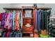 Walk in closet with built in shelving, with clothing and shoes neatly organized at 3729 Town Square Nw Cir # 6, Kennesaw, GA 30144