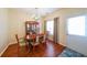 Cozy dining area with hardwood floors, chandelier, and traditional wooden furniture at 3729 Town Square Nw Cir # 6, Kennesaw, GA 30144