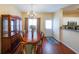 A spacious dining room with hardwood floors and a chandelier is ready for entertaining at 3729 Town Square Nw Cir # 6, Kennesaw, GA 30144