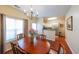 Charming dining room featuring a chandelier and hardwood floors next to kitchen at 3729 Town Square Nw Cir # 6, Kennesaw, GA 30144