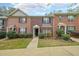 Charming brick townhome with black shutters, manicured lawn, and inviting front entrance at 3729 Town Square Nw Cir # 6, Kennesaw, GA 30144