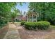 Inviting gazebo with swing surrounded by lush greenery and charming brick townhomes for outdoor relaxation at 3729 Town Square Nw Cir # 6, Kennesaw, GA 30144