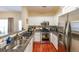 Modern kitchen with granite countertops, white cabinetry, and stainless steel appliances at 3729 Town Square Nw Cir # 6, Kennesaw, GA 30144