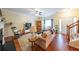 Spacious living room with hardwood floors, fireplace, and ample seating near entry at 3729 Town Square Nw Cir # 6, Kennesaw, GA 30144