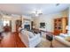 Cozy living room with hardwood floors, fireplace, and an open layout to adjacent spaces at 3729 Town Square Nw Cir # 6, Kennesaw, GA 30144