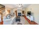 Bright living room with a cozy fireplace, wood floors, and a staircase to upper level at 3729 Town Square Nw Cir # 6, Kennesaw, GA 30144