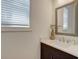 Bathroom featuring a vanity with white countertops and framed mirror at 724 Fairlane Dr, Marietta, GA 30064