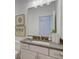 Bathroom featuring a vanity with framed mirror and decorative lighting at 724 Fairlane Dr, Marietta, GA 30064