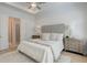 Bright bedroom with hardwood floors, tray ceiling, and ensuite bathroom at 724 Fairlane Dr, Marietta, GA 30064