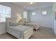 Sunlit bedroom featuring two twin beds with soft linens and a tranquil, neutral color palette at 724 Fairlane Dr, Marietta, GA 30064