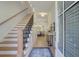 Bright foyer with hardwood floors, staircase, and elegant decor that leads into the dining room at 724 Fairlane Dr, Marietta, GA 30064