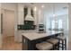 Modern kitchen with stainless steel appliances, quartz countertops, and an island with barstool seating at 724 Fairlane Dr, Marietta, GA 30064