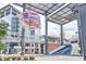 Wide shot of a popular plaza featuring overhead architectural elements and surrounding buildings at 724 Fairlane Dr, Marietta, GA 30064