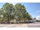 Picturesque town park featuring mature trees, streetlights, benches, and a crosswalk with a traffic light at 724 Fairlane Dr, Marietta, GA 30064