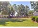 Well-manicured town park with a fountain, benches, lush lawn, and a gazebo on a sunny day at 724 Fairlane Dr, Marietta, GA 30064