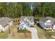 Stunning aerial view of home with manicured landscaping and mature trees at 3087 Mountain Shadow Way, Marietta, GA 30064