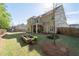 Large backyard featuring a garden and covered patio space at 3087 Mountain Shadow Way, Marietta, GA 30064